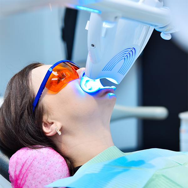 Dental patient getting professional teeth whitening