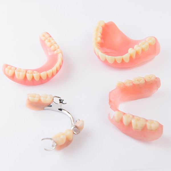 Two full dentures and two partials