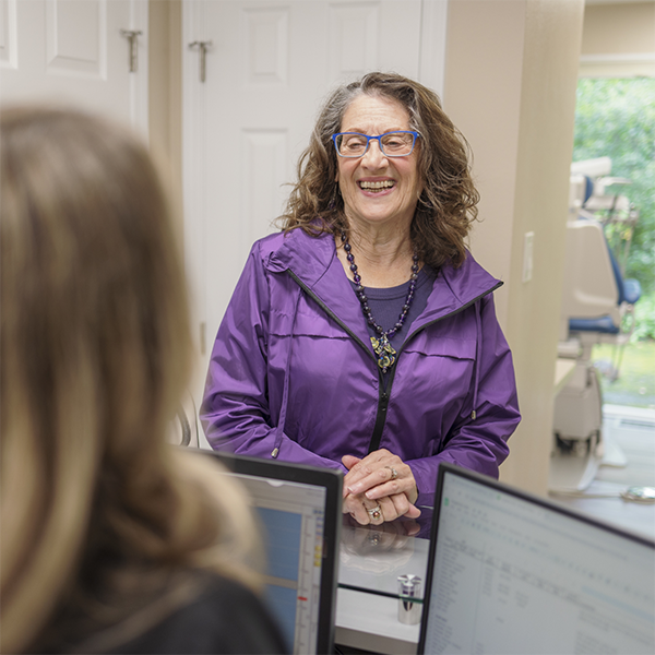 Woman checking in for her dental appointment