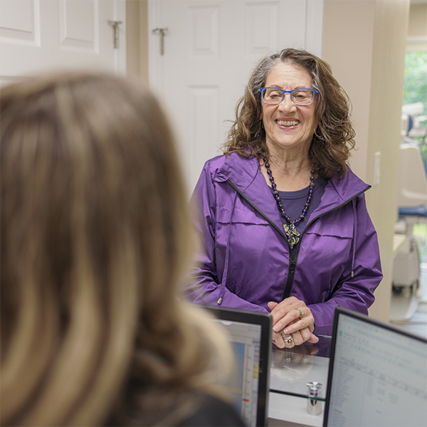 Woman checking in for her dental appointment