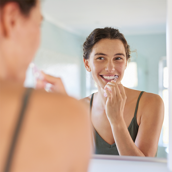 Woman brushing her teeth