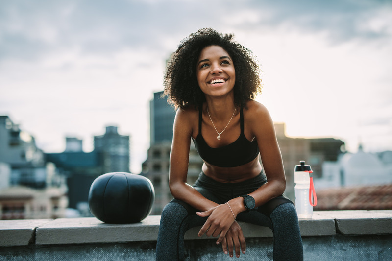Patient smiling while working out